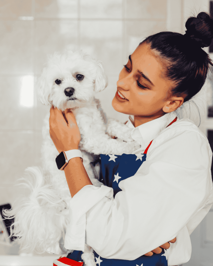 Happy dog with trusted groomer at PawBasic in Mississauga